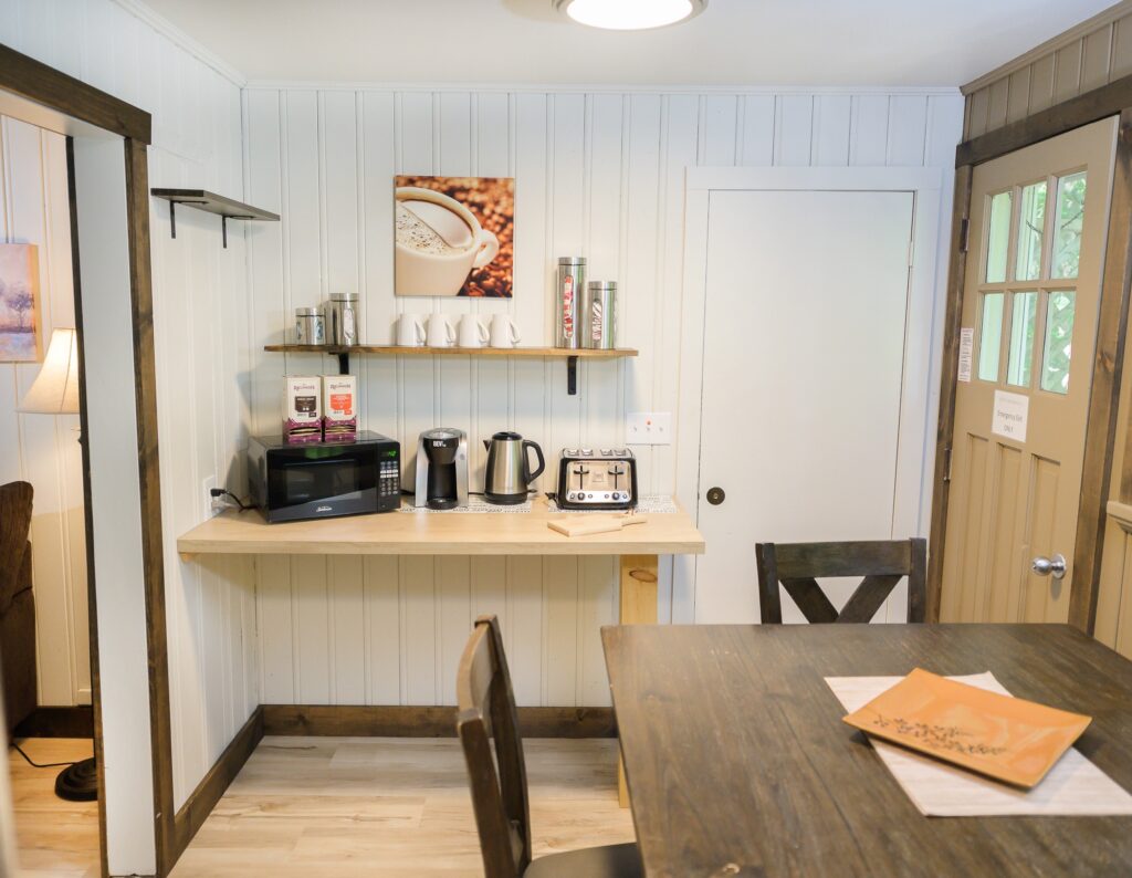 Dedicated coffee bar and beverage station with kettle and coffee maker in Falling Water cottage at Trillium Resort and Spa Muskoka
