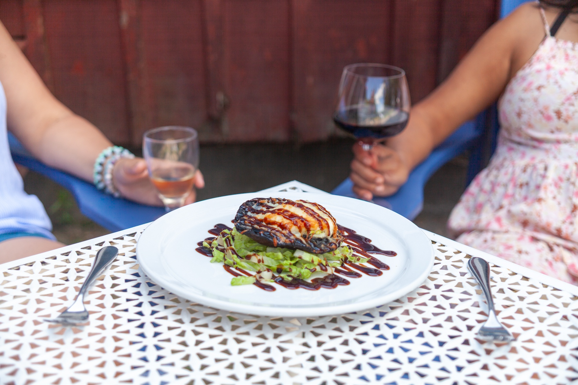 Gourmet portobello mushroom dish paired with wine on outdoor Muskoka patio at Trillium Resort and Spa restaurant Huntsville