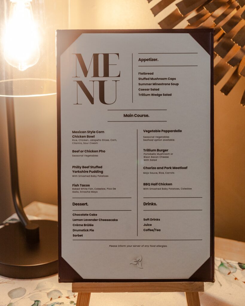 Elegant dinner menu displayed in candlelight at Trillium Resort and Spa inclusive restaurant Muskoka Huntsville Port Sydney